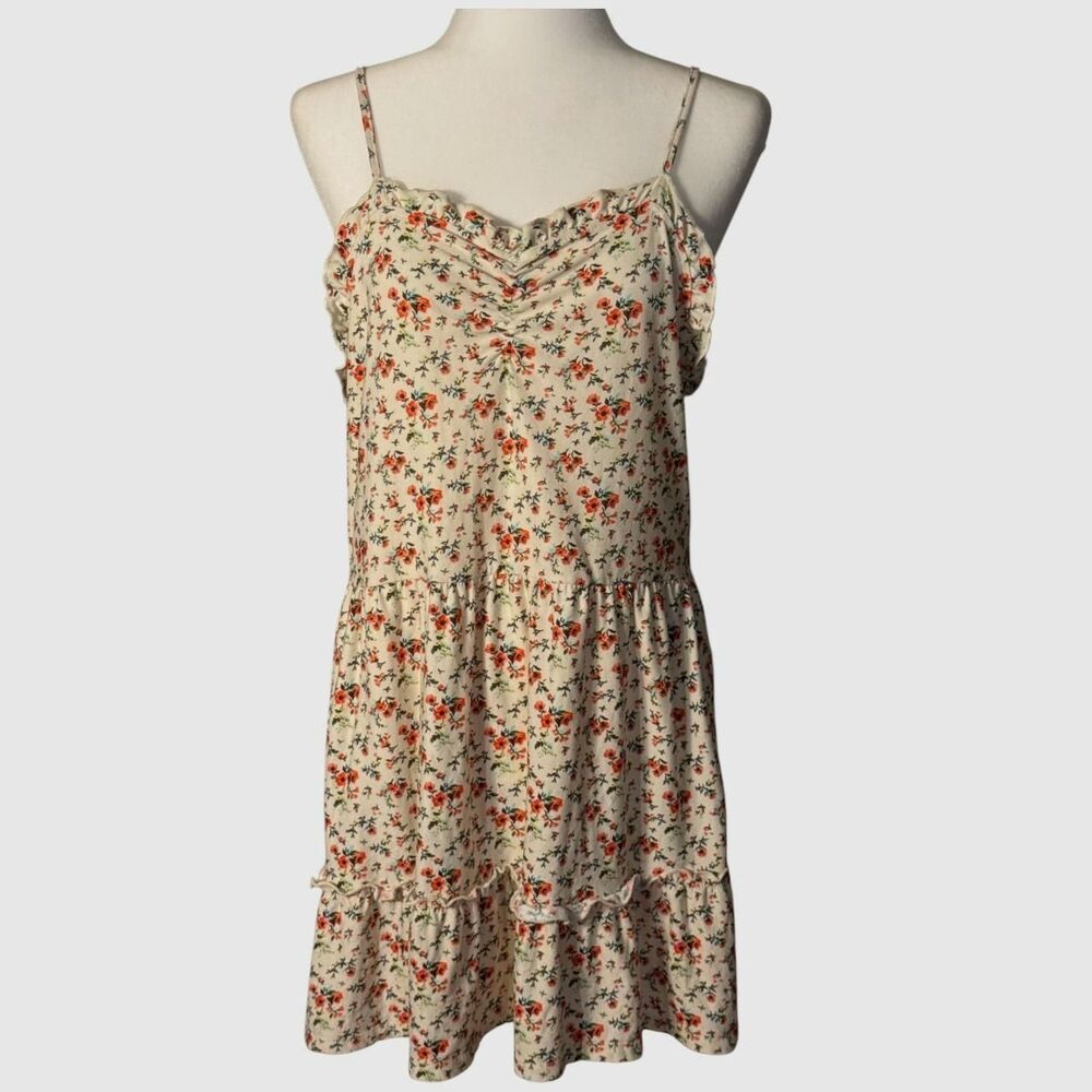Cream floral mini dress with ruffle details